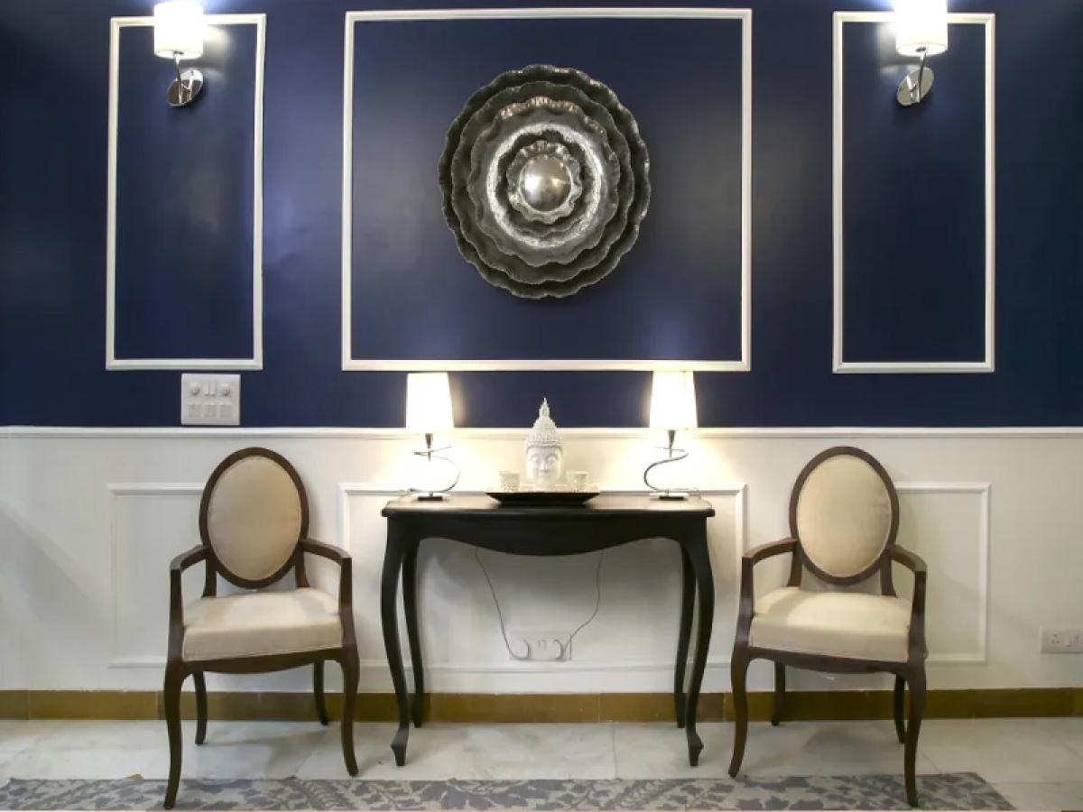 Classic Foyer Design With Wall Trims And Blue Accent Wall